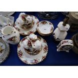 A Royal Albert Old Country Roses tea and dinner service with a Mason's lamp and clock Condition