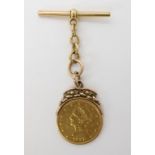 A gold Ten Dollar gold coin in soldered on 18ct gold 'T' bar mount, weight combined 29.8gms