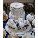 An extensive Susie Cooper Glen Mist dinner service comprising fourteen 27cm dinner plates, twenty