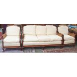 A Brights of Nettlebed reproduction mahogany bergere three piece suite comprising three seater sofa,