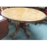 A Victorian oval walnut tilt top breakfast table on tripod base, 71cm high x 135cm wide x 102cm deep