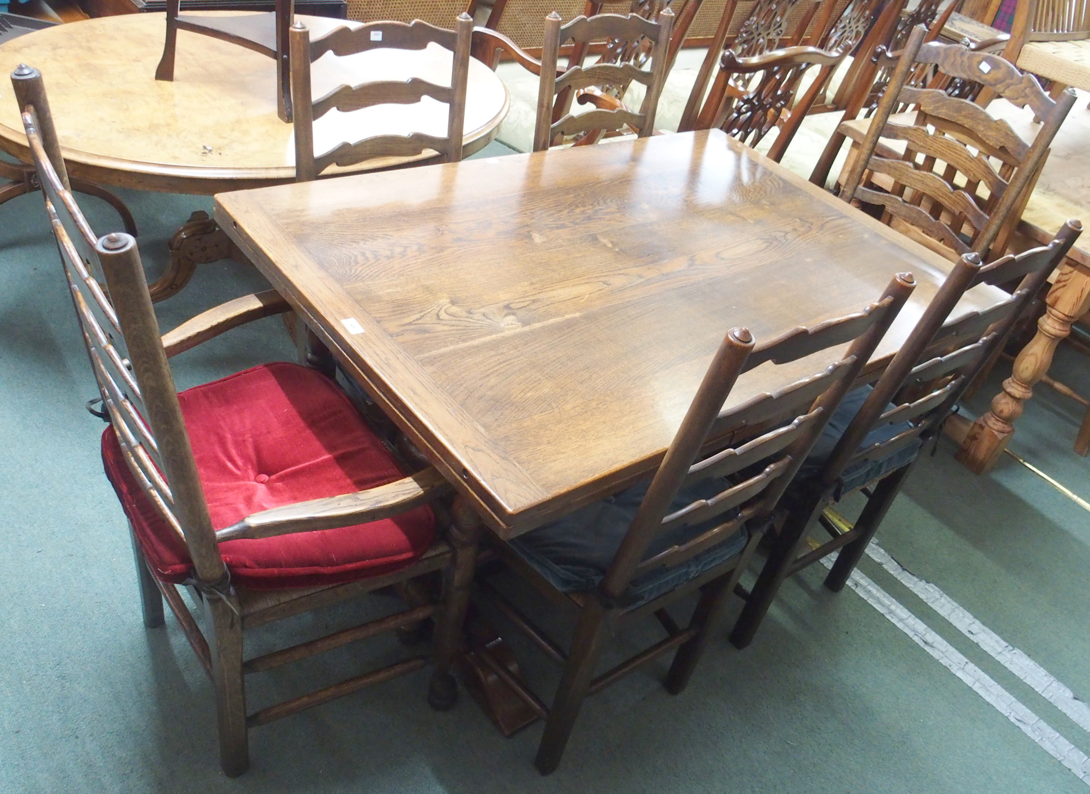 An oak extending dining table with baluster support , 76cm high x 136cm wide x 90cm deepwith six