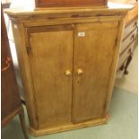 A Victorian pine corner cupboard with two doors 98cm high x 75cm wide Condition Report: Available