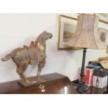 A painted wooden horse, 58cm high and a table lamp (2) Condition Report: Available upon request