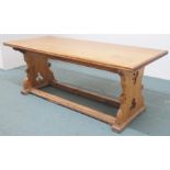 A pine alter table with carved supports and twin stretchers , 76cm high x 198cm wide x 84cm deep