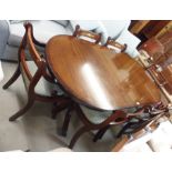 A reproduction mahogany twin pedestal dining table76cm high x 184cm wide x 93cm deep with two