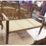 A continental beech settee with slat back and rush seat, 74cm high x 103cm wide Condition Report: