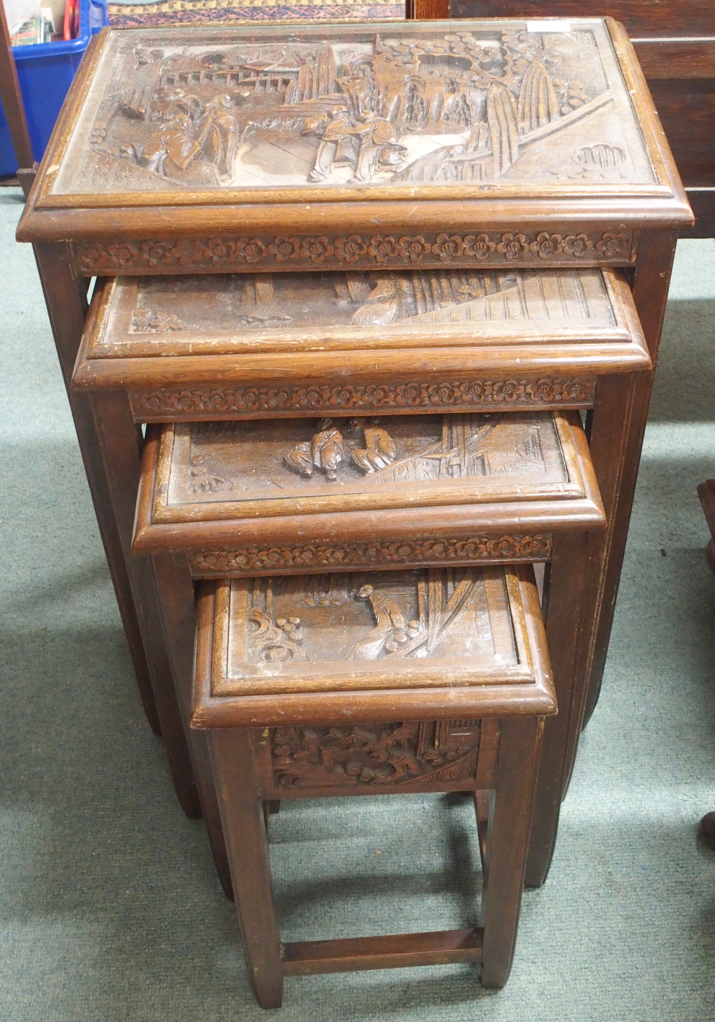 A nest of four Chinese carved tables Condition Report: Available upon request