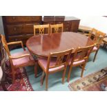 A dining room suite comprising dining table, four chairs, two carvers and a reproduction