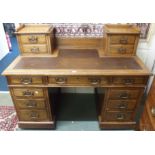 An oak pedestal desk with upper drawers 106cm high x 137cm wide Condition Report: Available upon