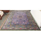 A large Chinese style wool rug, 332cm x 243cm Condition Report: Available upon request