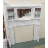 An Arts & Crafts white painted fireplace surround in the manner of the Glasgow designer E. A.