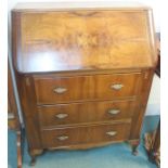 A walnut three drawer bureau Condition Report: Available upon request