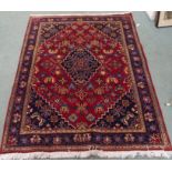A red ground Hamadan rug , 170cm x 150cm Condition Report: Available upon request