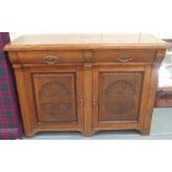 An oak sideboard with two drawers over two cupboard doors (mirror back def), 100cm high x 137cm wide