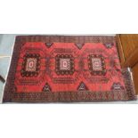 A red ground Eastern rug , 140cm x 89cm Condition Report: Available upon request