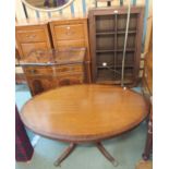 A modern open bookcase, a reproduction mahogany two door cabinet, an oval mahogany coffee table