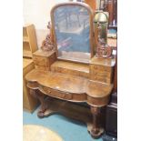 A walnut dressing table with mirror and carved supports, 165cm high x 120cm wide Condition Report: