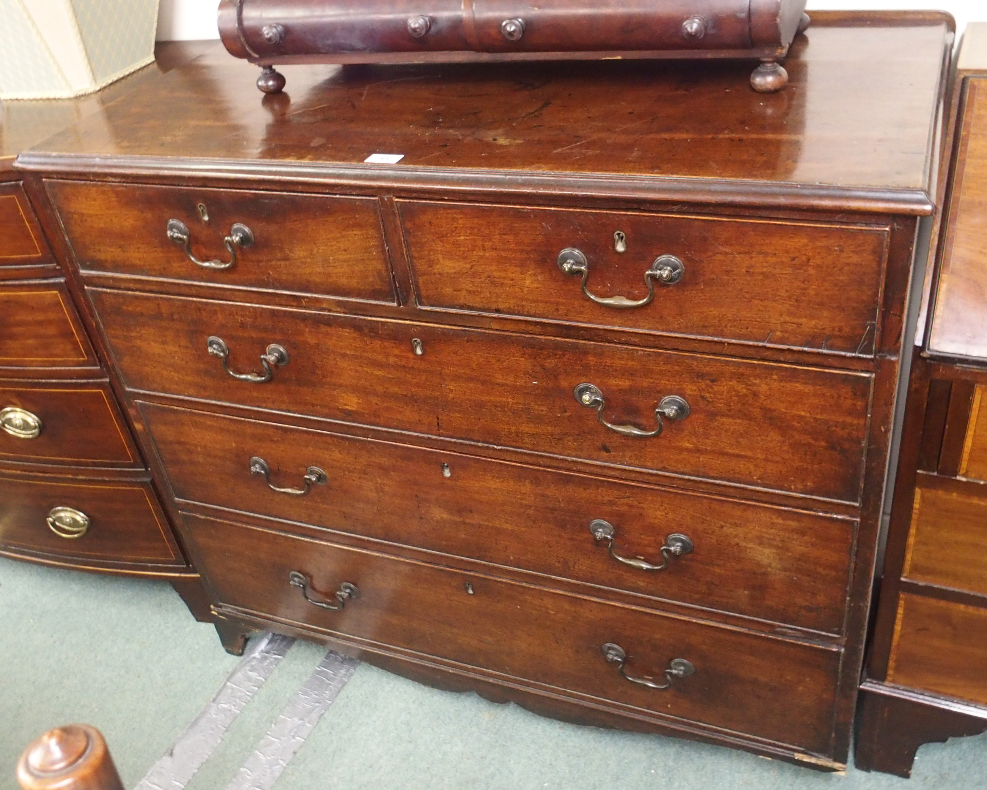 A Georgian mahogany two over three chest of drawers (def), 98cm high x 109cm wide Condition