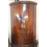 A Georgian mahogany bow front cabinet, 100cm high x 65cm wide Condition Report: Available upon