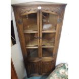 Am oak linen fold corner cabinet Condition Report: Available upon request