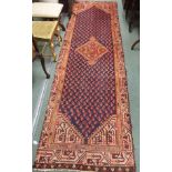 A blue ground Araak runner with central medallion, 307cm x 90cm Condition Report: Available upon