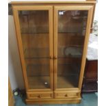 A modern display cabinet with two drawers, 143cm high x 84cm wide x 34cm deep