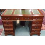 A reproduction mahogany pedestal desk with green leather skivers, 76cm high x 120cm wide Condition