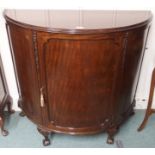 A mahogany bow front cabinet with single door, 99cm high x 108cm wide Condition Report: Available