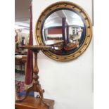 A circular gilt mirror and a walnut wine table (2) Condition Report: Available upon request