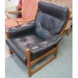 A green mid century leather armchair Condition Report: Available upon request