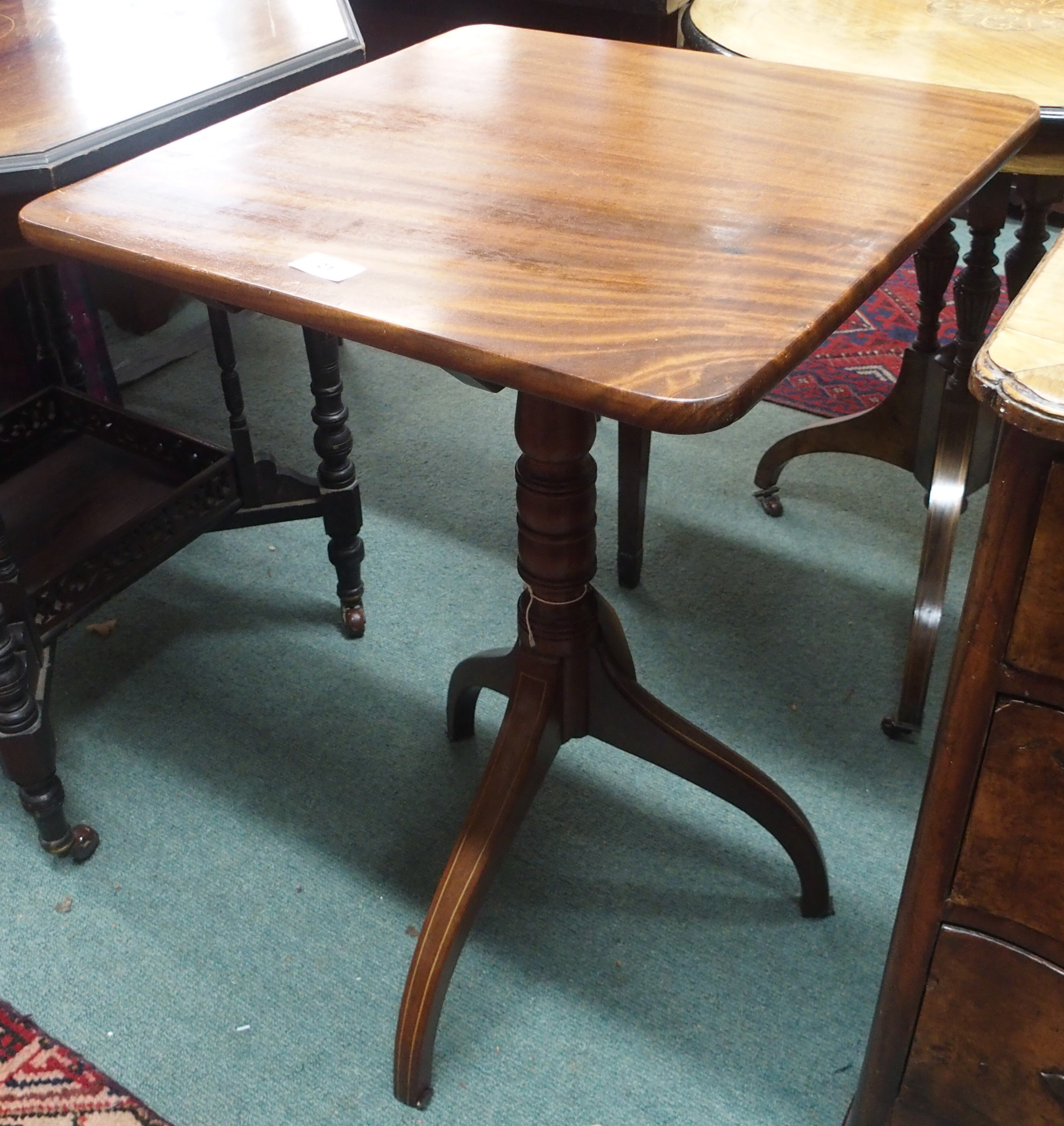 A mahogany tilt top table on tripod base Condition Report: Available upon request