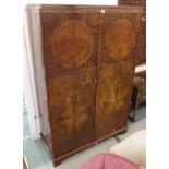 A mahogany and walnut two door wardrobe, 185cm high x 124cm wide Condition Report: Available upon
