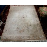 A cream ground rug, 165cm x 248cm Condition Report: Available upon request