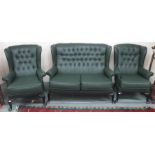 A green vinyl high back Chesterfield sofa with matching armchairs (3) Condition Report: Available