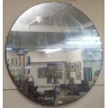 A large circular frameless wall mirror, 99cm diameter Condition Report: Available upon request