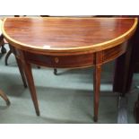 An inlaid mahogany fold over tea table Condition Report: Available upon request