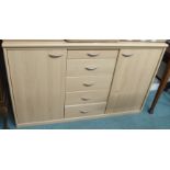 A modern sideboard with central drawers flanked by two doors Condition Report: Available upon