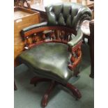 A green leather captains chair Condition Report: Available upon request
