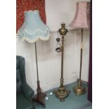 Two converted brass standard lamps and another standard lamp with mahogany base (3) Condition