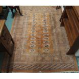 A modern terracotta ground Bokhara rug, 230cm x 158cm and two other rugs (3) Condition Report: