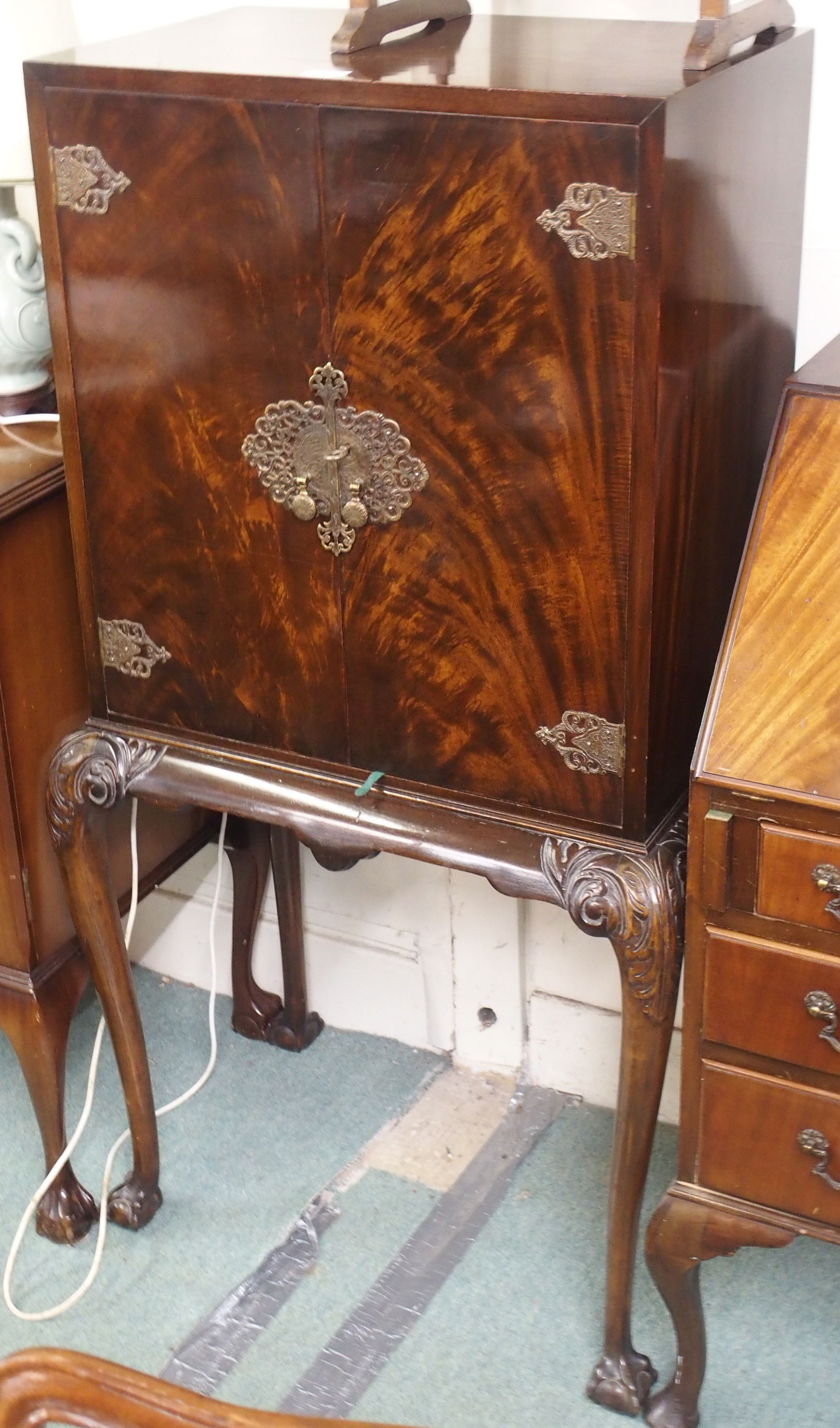 A walnut drinks cabinet, 132cm high x 70cm high Condition Report: Available upon request