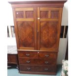 A mahogany linen press with two doors over two over two drawers, 208cm high x 124cm wide