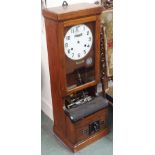 An oak National clocking in machine Condition Report: Available upon request