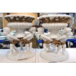 After Gian Lorenzo Bernini - A pair of alabaster effect resin cherub centrepieces with gilded