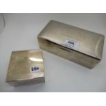 A lot comprising two silver cigarette boxes, 20.2cm x 10.5cm and 8.5cm square Condition Report: