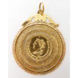 A bright yellow metal faux coin pendant with continental hallmarks, weight 8.7gms Condition