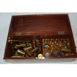 A collection of various microscope lenses etc in mahogany case Condition Report: Available upon