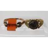 A yellow metal hair mourning ring, size approx M and a further rose colour metal ring with