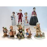 A Hummel figure Fish for two, depicting an Eskimo girl and seal, four other Hummels, Royal Worcester